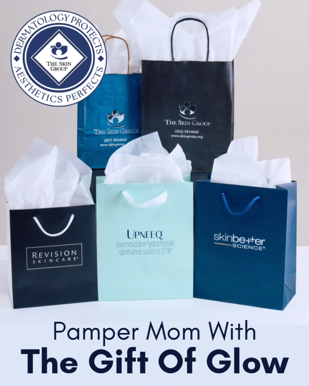 Assorted skincare gift bags with tissue paper arranged for a 'Pamper Mom With The Gift Of Glow' promotion on a light background.